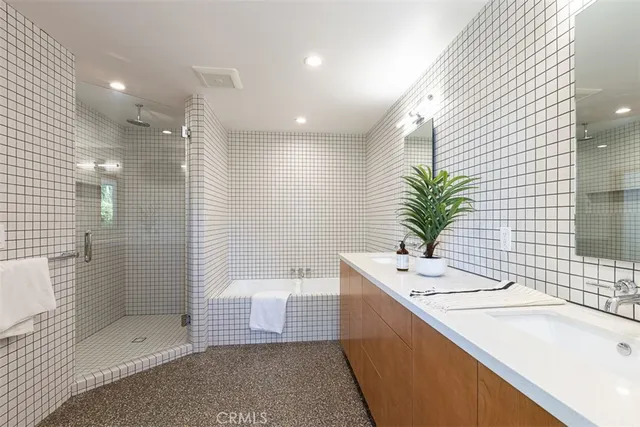 a white toilet sitting next to a bathroom sink