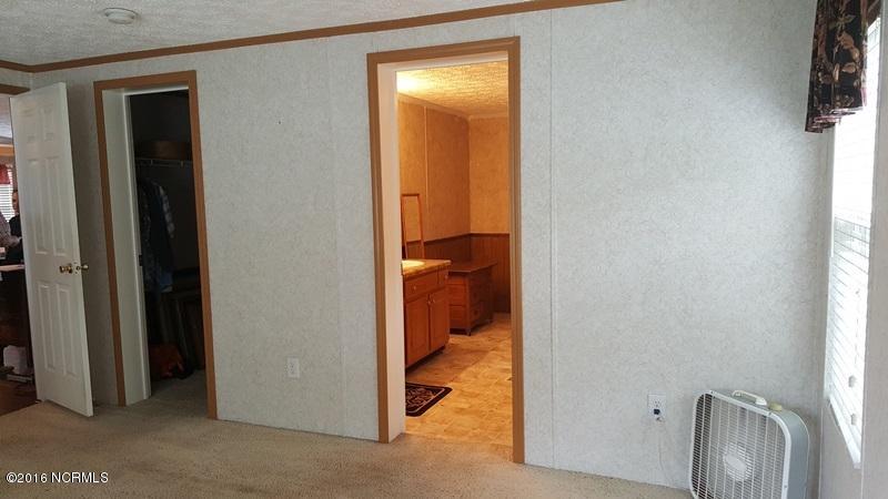 1338 Makelyville Road Scranton, NC 27875 - Photo 18 of 32 Walk in Closet in Master Bedroom
