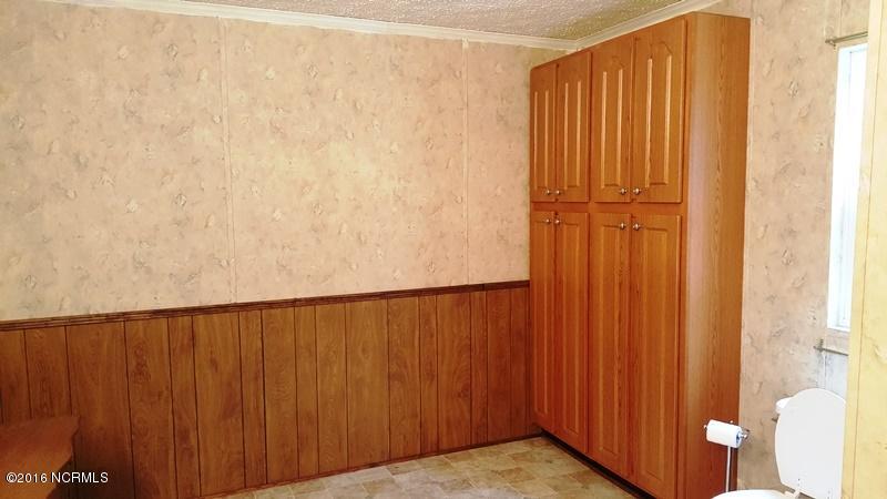 1338 Makelyville Road Scranton, NC 27875 - Photo 19 of 32 Master Bath Linen Cabinet