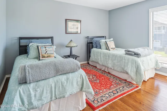 a bedroom with a bed and a lamp