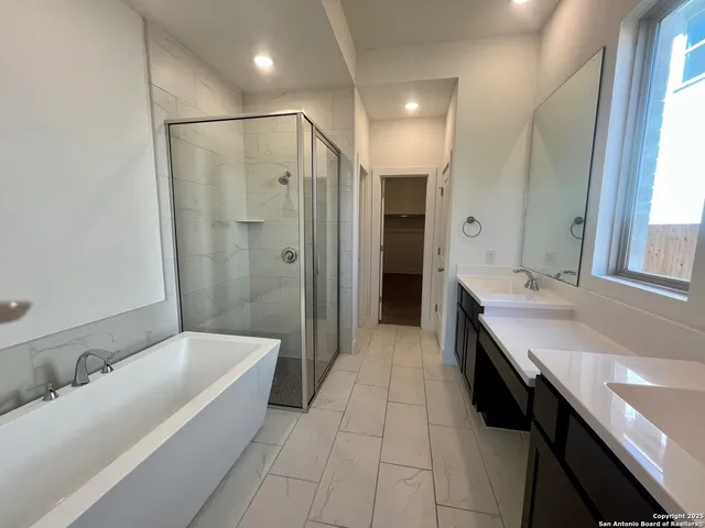 a bathroom with a sink a double vanity and a mirror