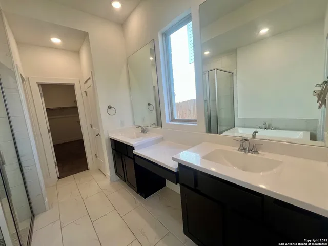 a bathroom with a bathtub and a shower