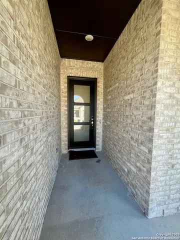 a view of hallway with stairs and wooden floor