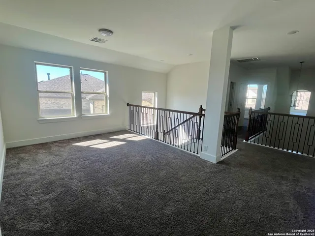 an empty room with a empty space and a window