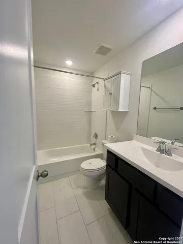 a view of a hallway with seating space