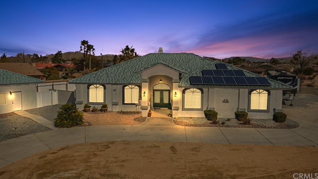 19764 Shoshonee Road Apple Valley, CA 92307 - Photo 1 of 1 a view of multiple houses with a road