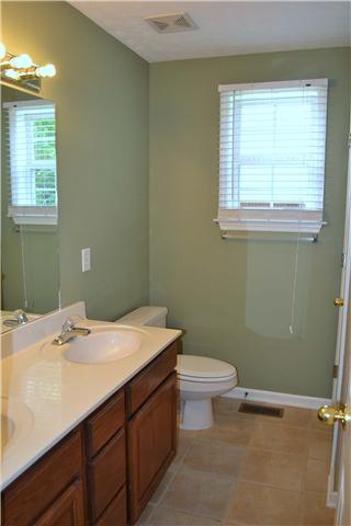 130 La View Road Hendersonville, TN 37075 - Photo 14 of 20 The Master Bath boasts a tile floor, large double bowl vanity, linen closet, window for natural lighting, and a tub/shower combination with tile surround.