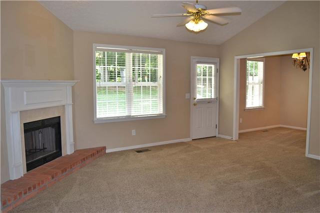 130 La View Road Hendersonville, TN 37075 - Photo 5 of 20 Living Room features a charming corner gas fireplace with brick hearth, marble surround,& pretty wooden mantel. It also has a double window overlooking the lush backyard, atrium door with tiled entry & full view glass storm door& lighted ceiling fan