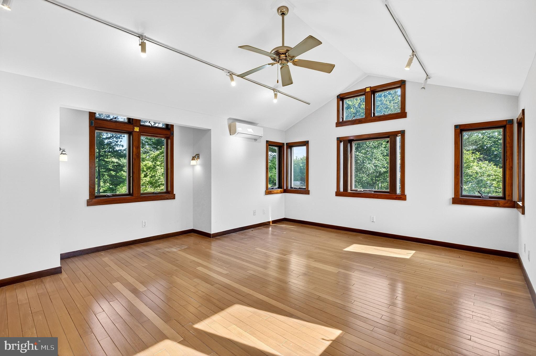 498 Perrineville Road Robbinsville, NJ 08691 - Photo 33 of 59 a view of an empty room with window and wooden floor