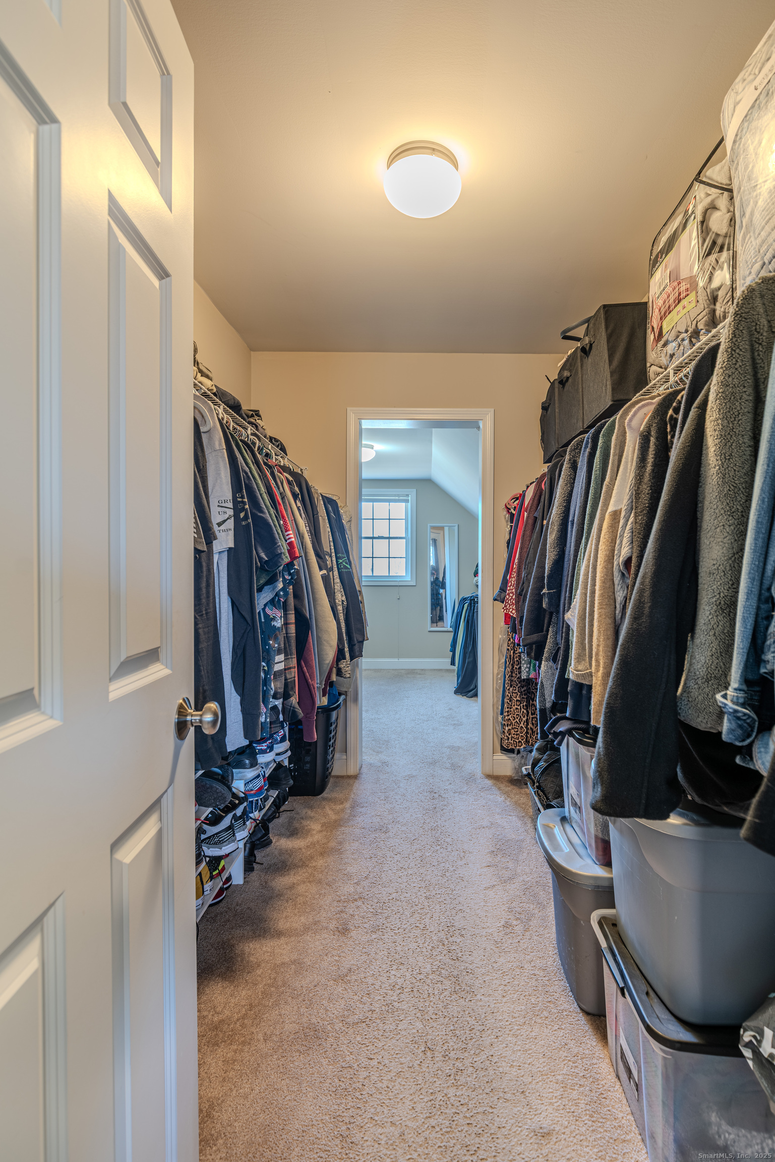 44 Trailside Crossing Middletown, CT 06457 - Photo 22 of 40 a view of walk in closet with clothes and shoes