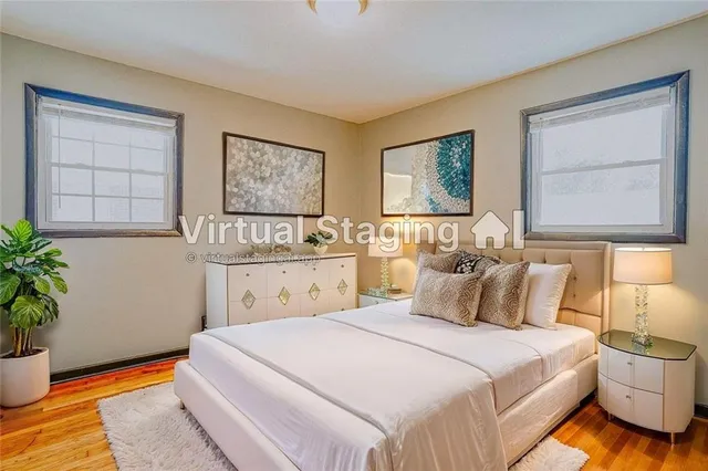 a bedroom with a bed and window