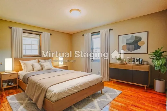 a bedroom with a bed and a dresser