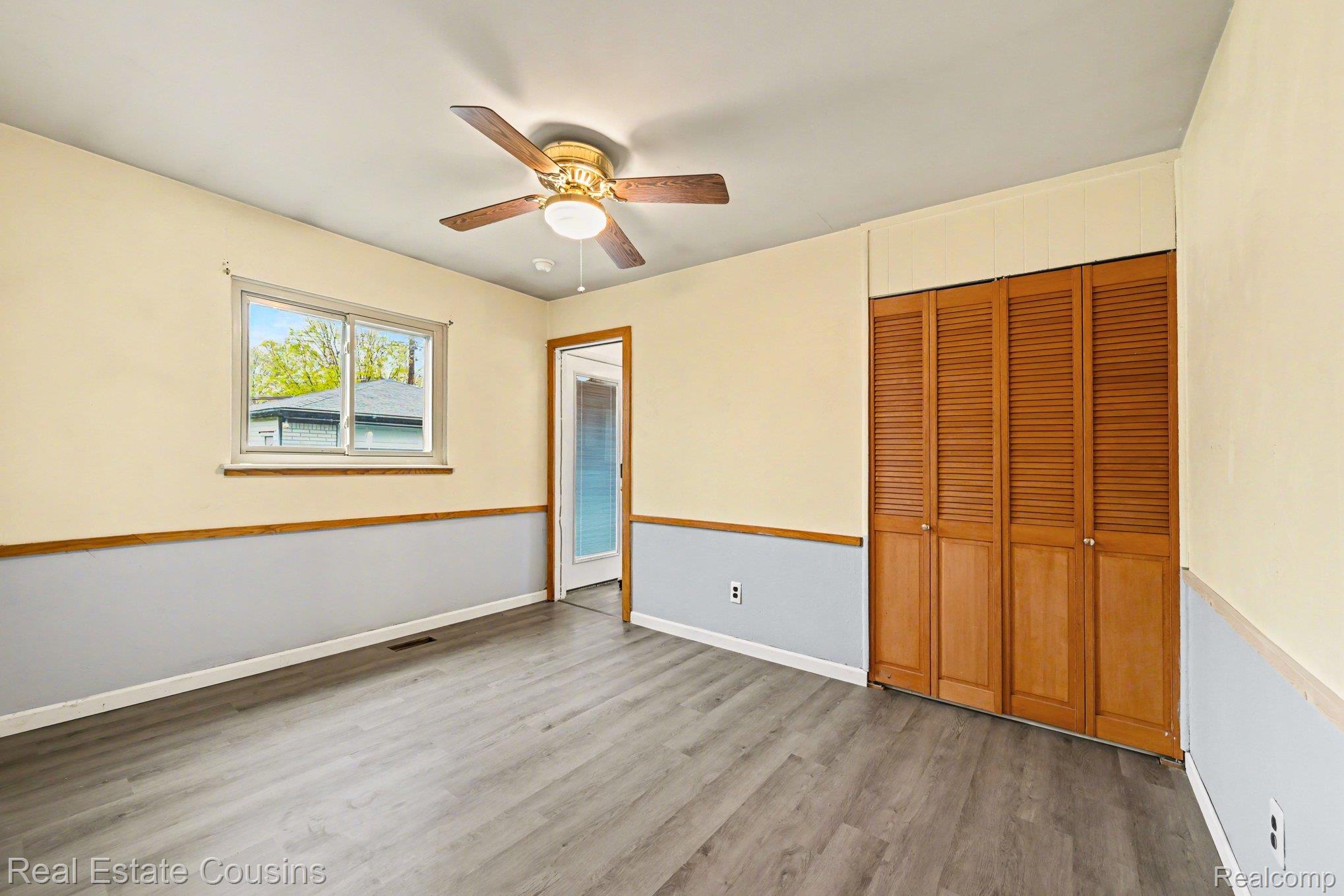 32224 Joy Road Livonia, MI 48150 - Photo 13 of 33 Unfurnished bedroom with a closet, ceiling fan, and light wood finished floors