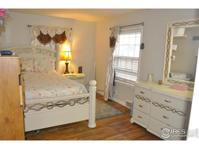 a living room with a dresser