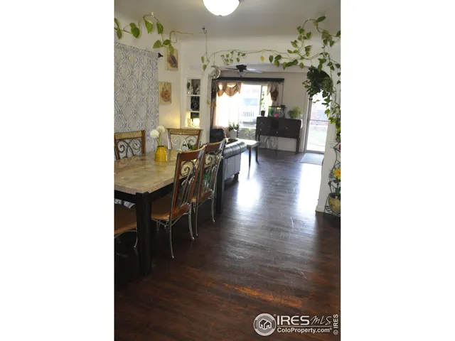 a view of a dining area with furniture and wooden floor