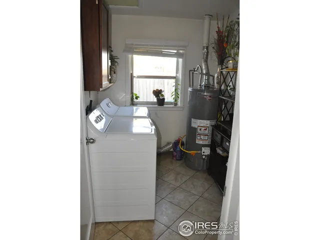 a view of a living room with a table and a fireplace