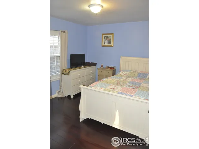 a living room with a couch and a flat screen tv