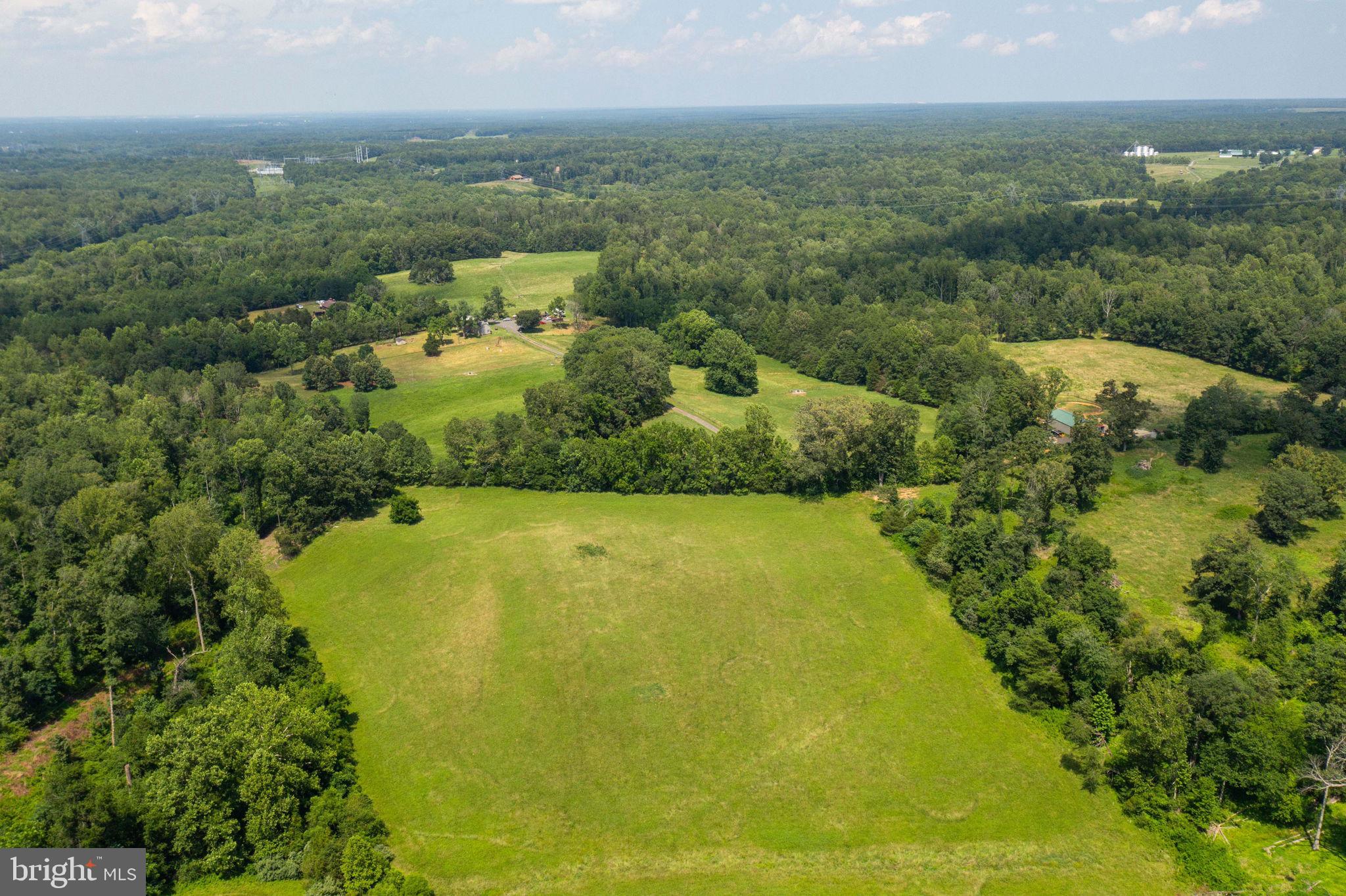 11997 Bristersburg Road Midland, VA 22728 - Photo 31 of 38 a view of a large pool with lawn chairs and large trees