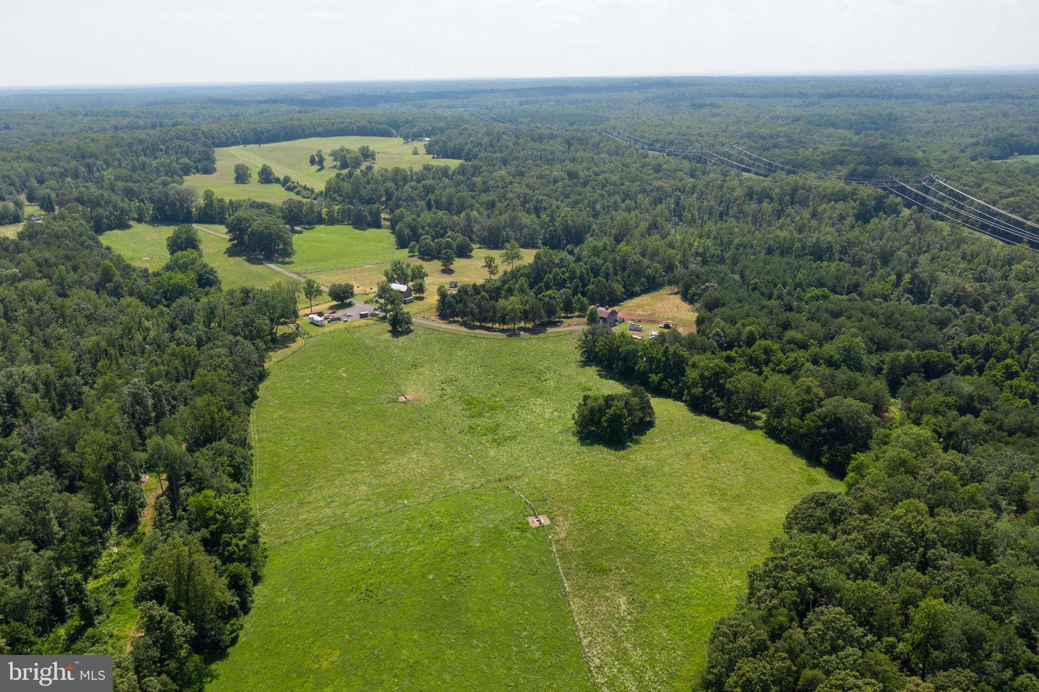 11997 Bristersburg Road Midland, VA 22728 - Photo 32 of 38 a view of a garden with a building in background
