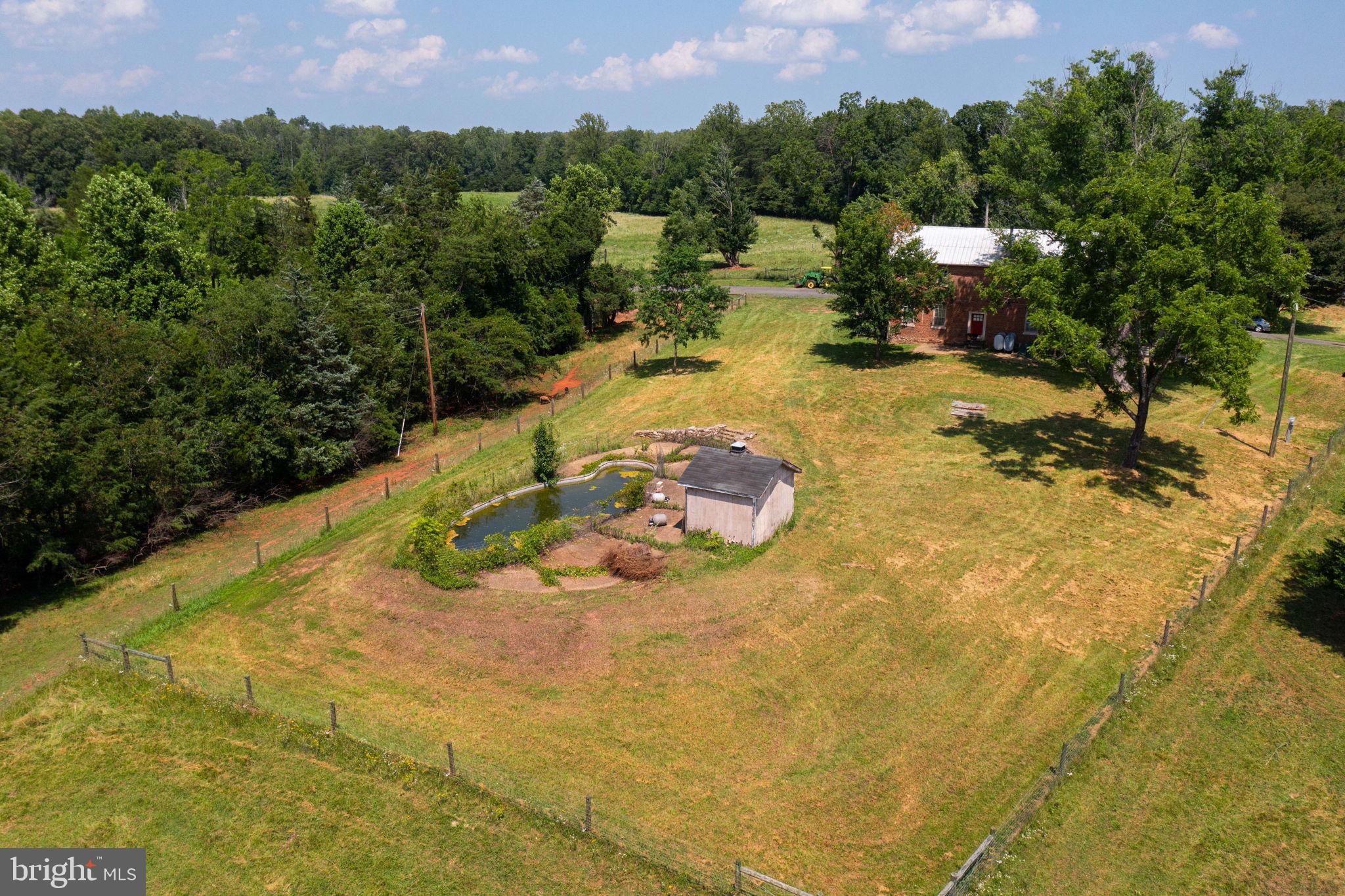 11997 Bristersburg Road Midland, VA 22728 - Photo 8 of 38 a view of a swimming pool with a yard