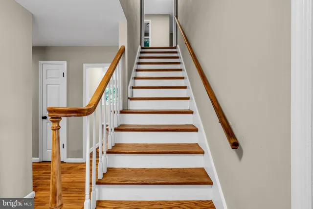 a view of wooden floor and windows in a room