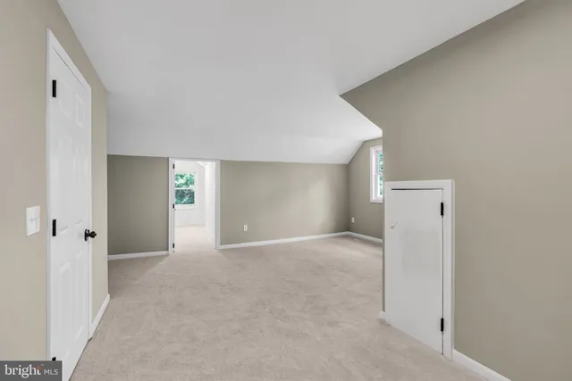 a bathroom with a toilet a sink and a window