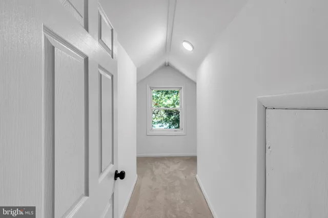 a view of grassy field with benches