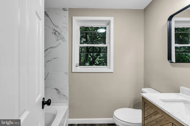 a view of green field with trees