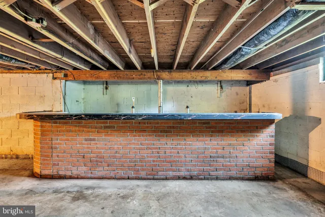 front view of a house with a tree in a yard