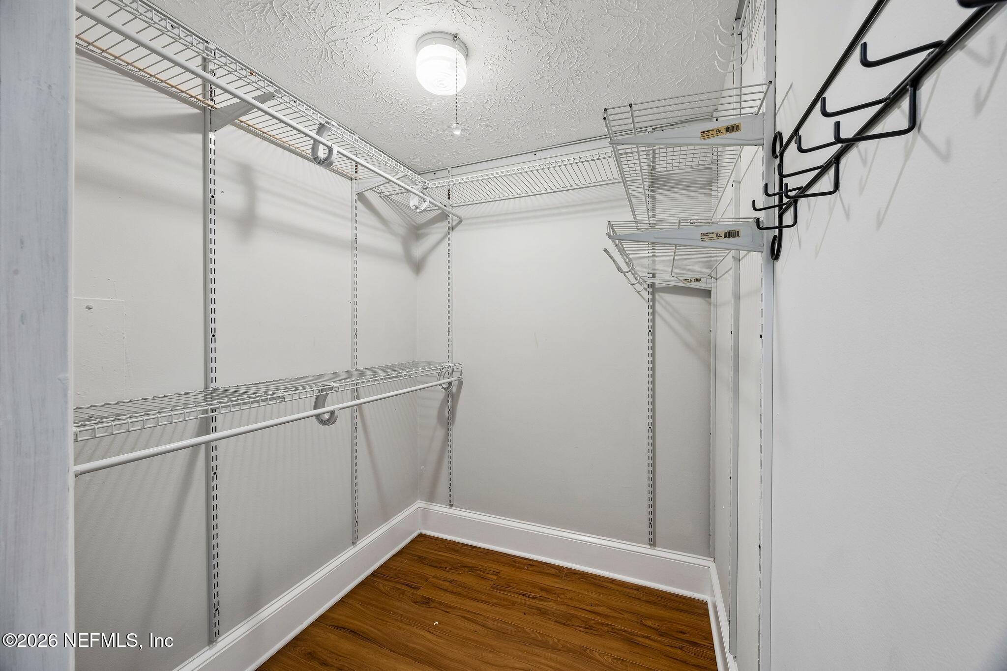 4358 Timuquana Road, Unit 134 Jacksonville, FL 32210 - Photo 13 of 31 a view of a room with racks on the wall