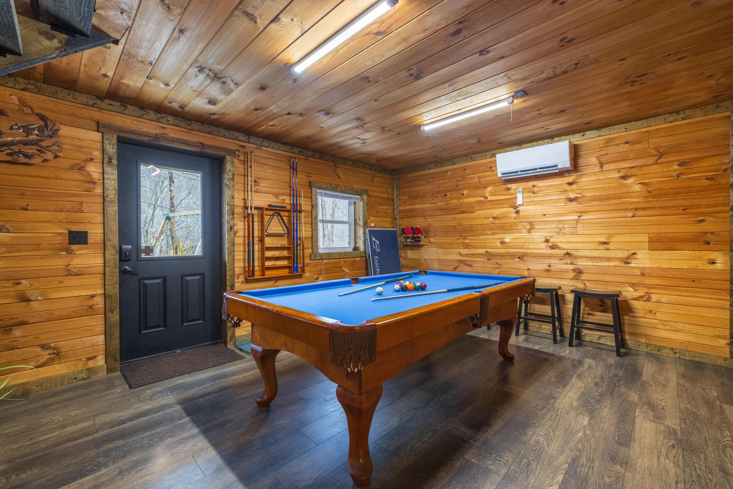 344 Skaggs Road Londonderry, OH 45647 - Photo 41 of 57 Sage Hill Cabin lower level walk out basement entertainment room