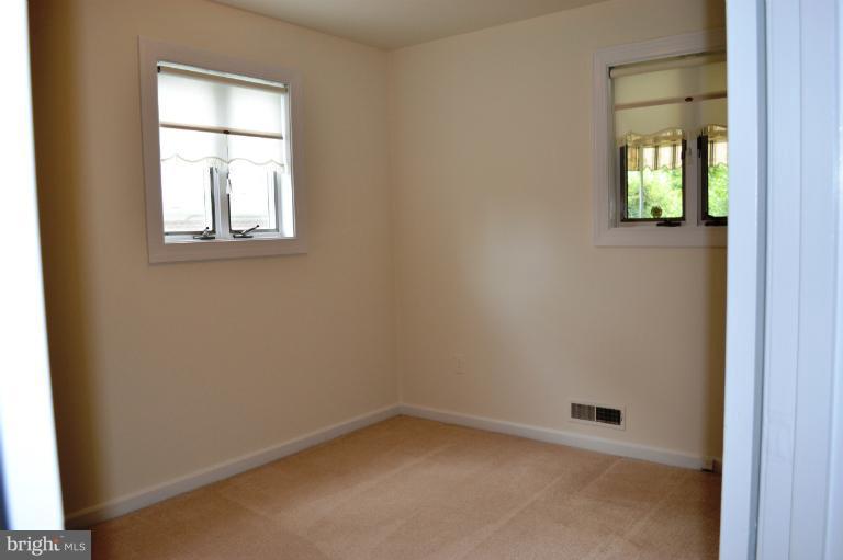 12702 Feldon Street Silver Spring, MD 20906 - Photo 7 of 11 an empty room that has a window