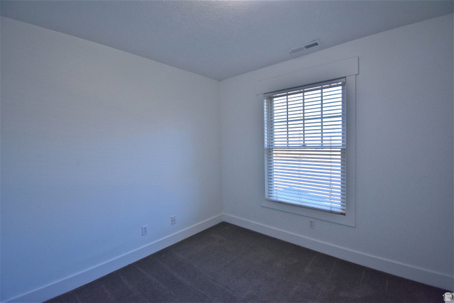2480 West 450 South, Unit 2 Springville, UT 84663 - Photo 13 of 19 Bedroom with baseboards and dark colored carpet