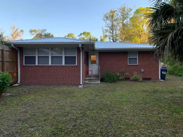 a backyard of a house with lots of green space