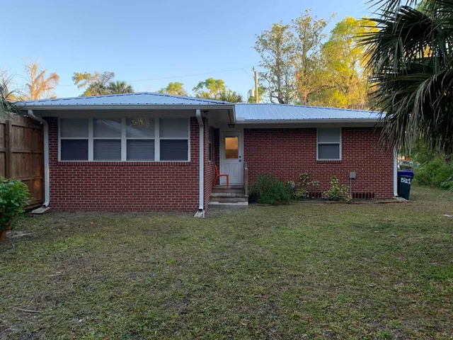 a backyard of a house with lots of green space