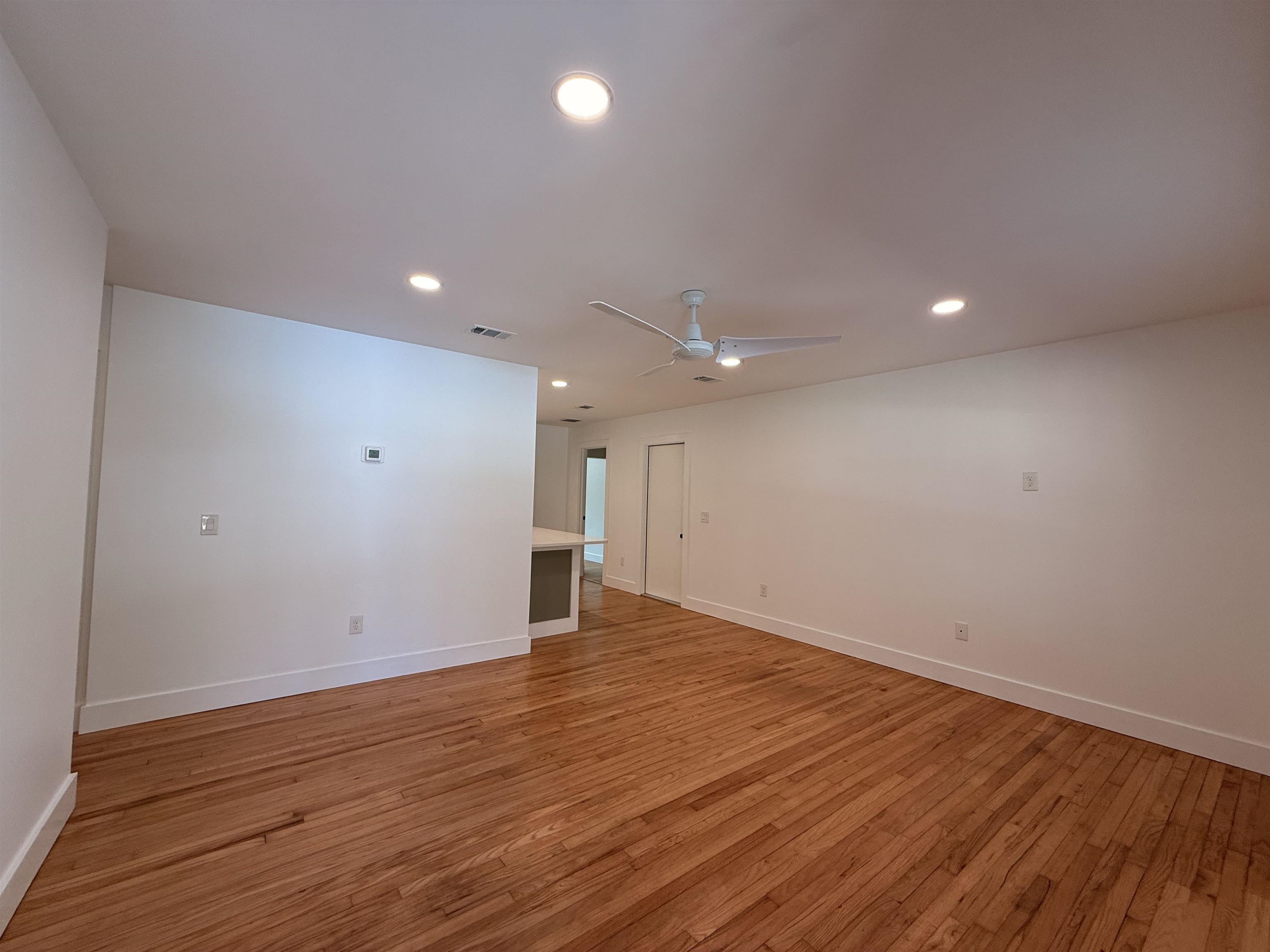 521 Christopher Street St. Augustine, FL 32084 - Photo 3 of 17 a view of an empty room with wooden floor