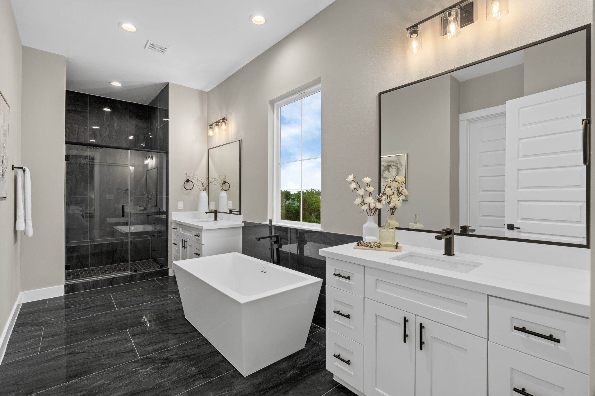 1177 West 19th Street Houston, TX 77008 - Photo 33 of 40 a bathroom with a double vanity sink a mirror and a shower