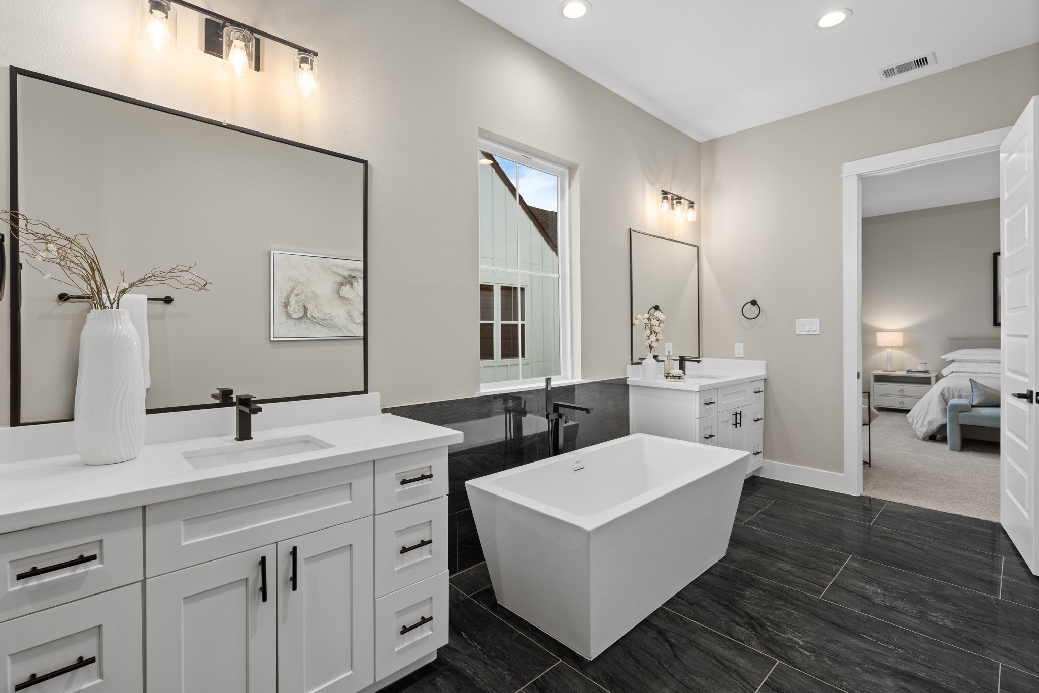 1177 West 19th Street Houston, TX 77008 - Photo 35 of 40 a spacious bathroom with a double vanity sink and a mirror