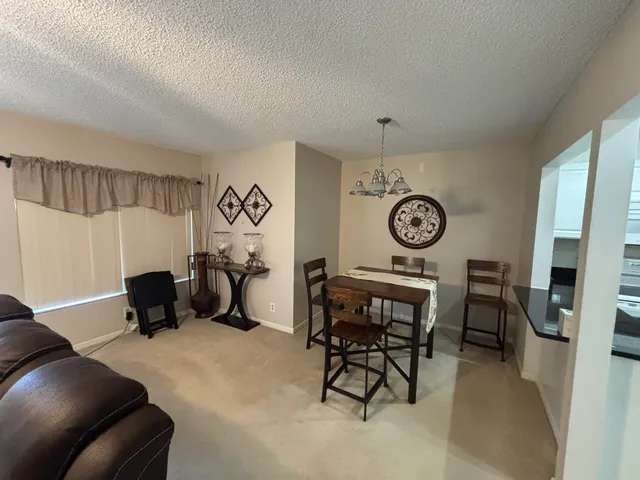 a view of a livingroom with furniture and a clock