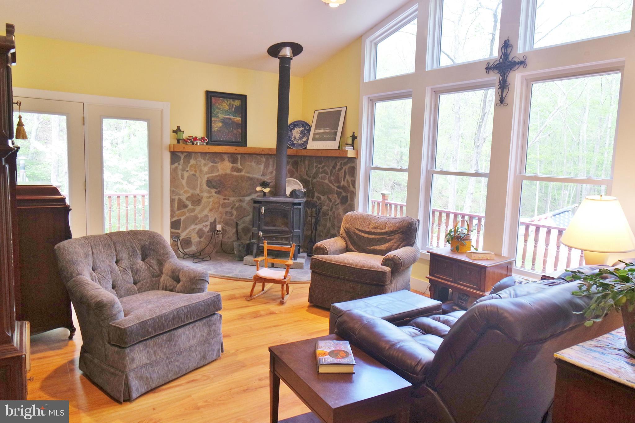974 North Maple Road Mount Jackson, VA 22842 - Photo 13 of 30 a living room with furniture a large window and a chandelier