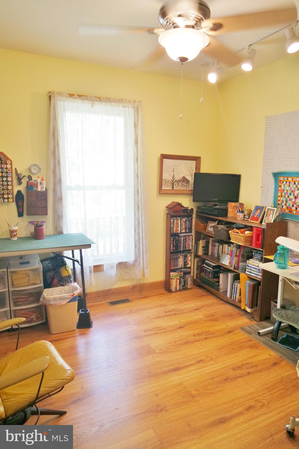 974 North Maple Road Mount Jackson, VA 22842 - Photo 22 of 30 a living room with furniture and a flat screen tv