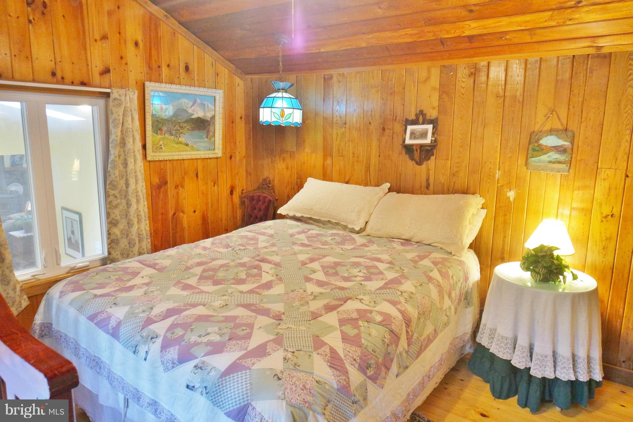 974 North Maple Road Mount Jackson, VA 22842 - Photo 24 of 30 a bedroom with a bed and a painting on the wall