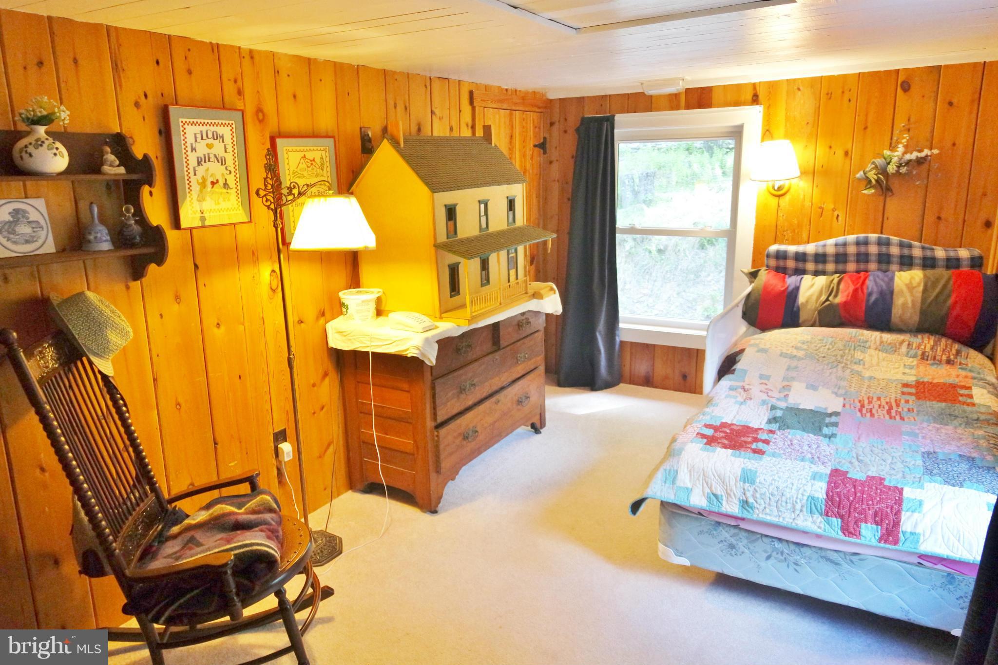 974 North Maple Road Mount Jackson, VA 22842 - Photo 25 of 30 a bedroom with a bed and wooden floor