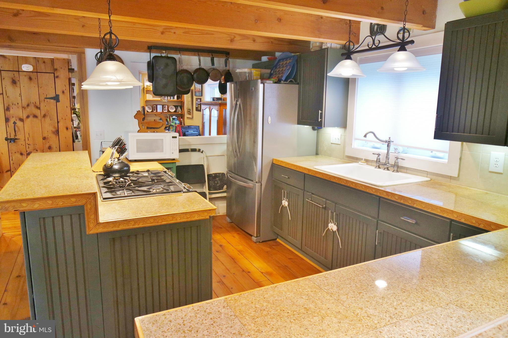 974 North Maple Road Mount Jackson, VA 22842 - Photo 5 of 30 a kitchen with stainless steel appliances kitchen island granite countertop a sink and cabinets