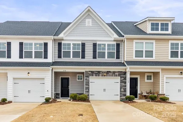 front view of a building with a yard