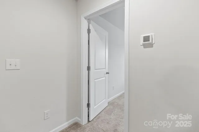 a view of a hallway with closet