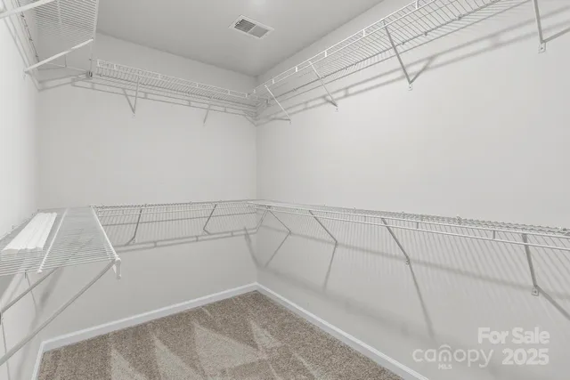 a view of a room with racks on the wall