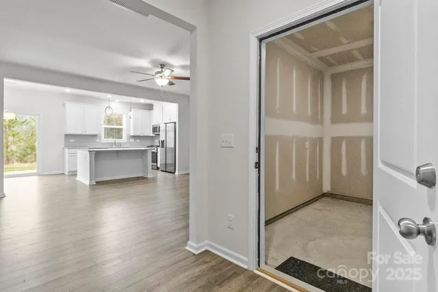 a view of a kitchen cabinets and wooden floor