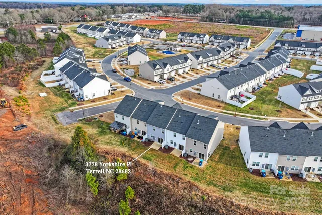 an aerial view of a house with a garden