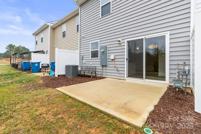 a view of a house with snow on the road